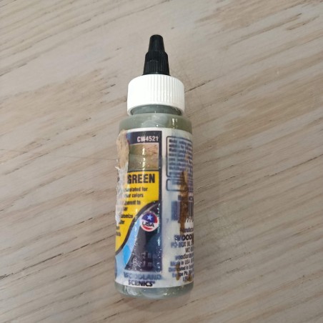 Water Tint: Moss green | Container with adhesive residue.