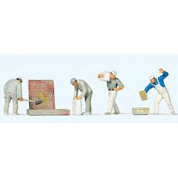 Bricklayers working with tools.