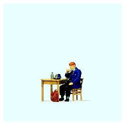 Railwayman eating breakfast.