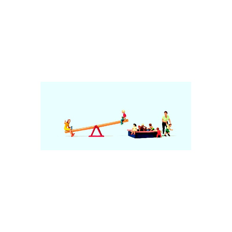 Children play with seesaw and sandpit. PREISER 10587
