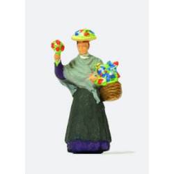 Dama vendiendo flores.