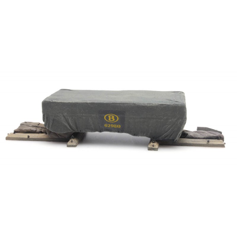 Shipping crate under tarpaulin. Shipping crate under tarpaulin.