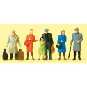 Standing travelers with luggage. Standing travelers with luggage.