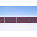 Industrial wall with steel T-profiles.