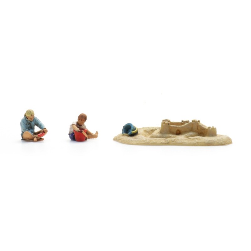 Children with sand castle. Children with sand castle.